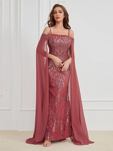 Detailed view of shimmering silver sequins and rose red chiffon fabric on an evening dress