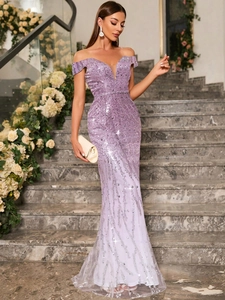 Detail of lavender sequined evening gown with off-shoulder neckline and silver tassels
