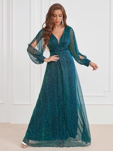 Close-up of elegant deep teal V-neck sequined evening gown with ruched waist and split sleeves
