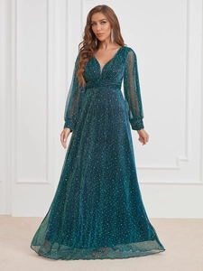 Detailed texture of pleated teal evening gown with sparkling metallic finish and V-neck