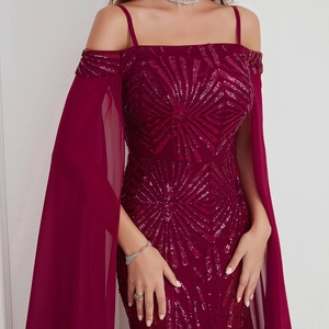 Detail of burgundy sequin off-shoulder evening dress with flowing chiffon sleeves