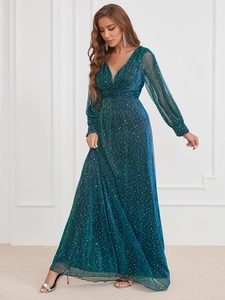 Detail of teal sequined evening gown featuring pleated texture and elegant V-neck design