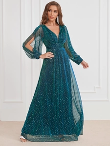Detail of teal evening gown with silver sequins, V-neck, and split lantern sleeves