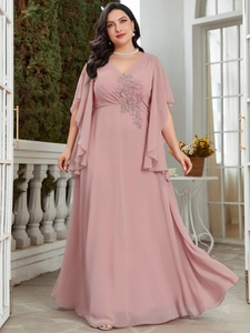 Close-up of elegant V-neckline with delicate floral sequins on dusty pink chiffon dress