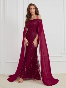 Close-up of sparkling burgundy sequins and elegant chiffon cape sleeves on a gown