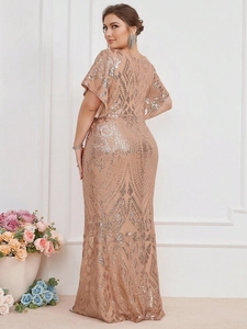 Detail of champagne gold evening dress featuring geometric sequins and ruffle sleeves