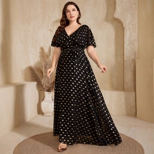 Elegant plus size black V-neck maxi dress with gold polka dots and flutter sleeves