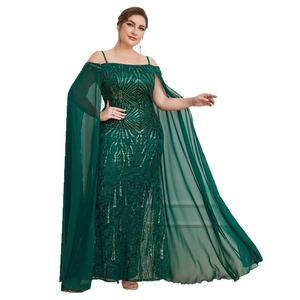 Elegant dark green sequin gown with geometric patterns and flowing chiffon cape sleeves
