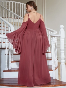 Detail view of the cold-shoulder burgundy evening dress with layered sleeves and V-neck back