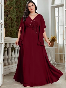 Detail of sequin floral embroidery and ruffle cape sleeves on burgundy chiffon dress