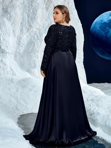 Detail of sequined bodice and satin skirt on navy blue evening gown in polar setting