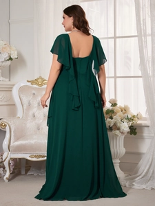 Detailed back view of dark green chiffon evening dress with ruffled sleeves and open back