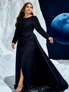 Detail of navy blue sequin bodice and satin pleated skirt with high side slit design