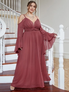 Detailed view of flutter sleeves and pleated high waist on a mauve plus size evening gown