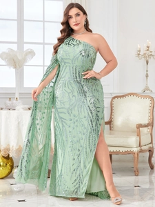 Detailed embroidery of silver sequin vine patterns on a mint green one-shoulder evening gown