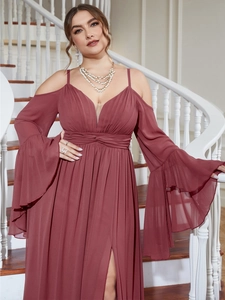 Detailed view of off-shoulder wine red evening gown with bell sleeves and high slit