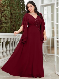 Detail view of wine red evening dress featuring V-neck and embroidered sequins on waist