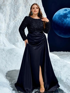 Detailed close-up of sequined bodice and navy satin drape on elegant evening gown