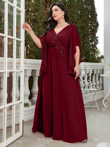 Detail of burgundy chiffon gown featuring sequined floral embroidery and tiered ruffle sleeves