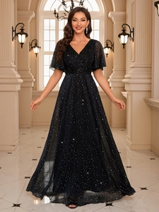 Close-up of sparkling navy blue sequins and ruffle sleeves on the elegant V-neck gown
