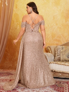 Detail of champagne gold sequin gown showing the criss-cross lace-up back and long train