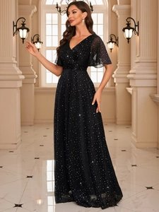 Detail of elegant sequined evening gown featuring ruffled sleeves and a slimming V-neckline