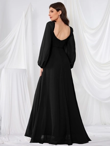 Detail of elegant backless black chiffon evening gown with lantern sleeves and zipper