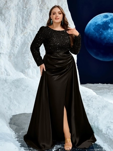 Detailed view of sequined bodice and glossy satin skirt on a black evening gown
