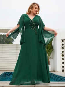 Detail of beaded floral embroidery and sequins on dark green chiffon evening dress