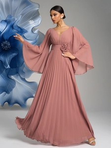 Detail of grey-pink chiffon dress with V-neck, bell sleeves and 3D floral waist embellishment