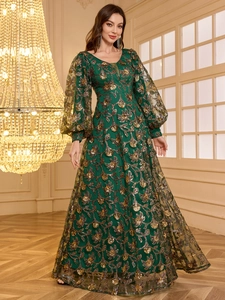 Elegant emerald green V-neck evening gown with gold floral embroidery and sequin lantern sleeves