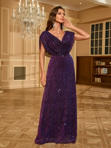 Detail of elegant dark purple evening gown featuring shimmering sequins and draped neckline