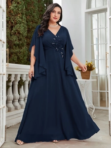 Close-up of floral embroidery and delicate beadwork on navy blue chiffon evening gown