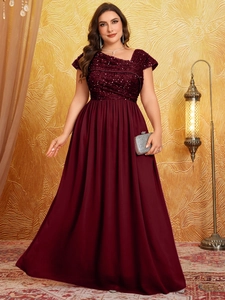 Detail of burgundy sequined bodice and pleated chiffon evening gown with elegant drape