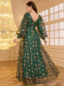 Elegant emerald V-neck evening gown with golden sequin floral embroidery and lantern sleeves
