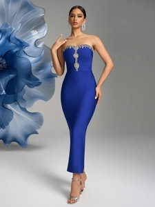 Close-up of royal blue bandage dress with vertical silver rhinestone detailing on the chest
