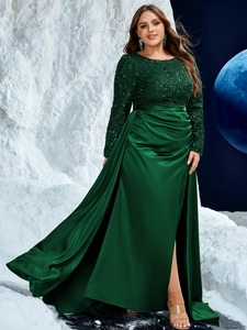 Close-up of dark green sequins on the bodice and glossy satin pleated waist detail