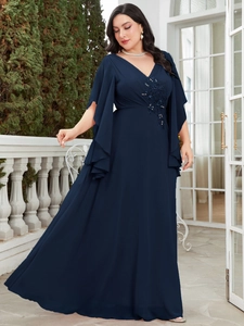 Detail of elegant V-neckline with navy blue floral embroidery and sequin embellishments