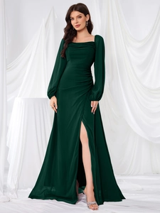 Detailed close-up of dark green square neck dress with pleated waist and high side slit