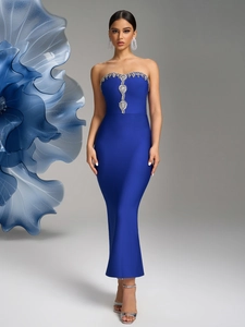 Detail of royal blue bandage dress featuring crystal embellishments and sleek bodycon fit