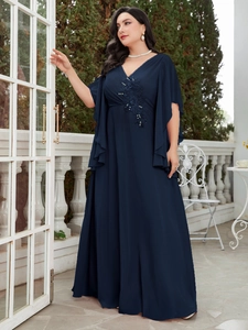 Detail of navy blue plus size dress featuring intricate floral embroidery and sequins