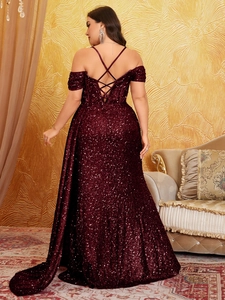 Detailed back view of sequin gown featuring corset criss-cross straps and lace-up closure
