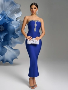 Detail of royal blue strapless bandage dress with shimmering silver rhinestone trim