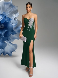 Detail of emerald green strapless dress featuring silver sequin floral embellishments