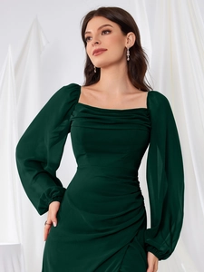 Close-up of dark green square neck dress featuring draped pleated waist and lantern sleeves