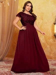 Close-up of sparkling sequins and pleated chiffon on a burgundy evening gown