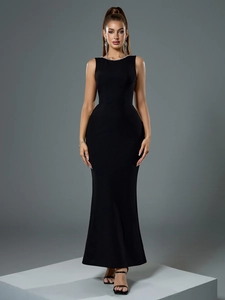 Detailed view of the elegant pearl neckline on a black backless evening fishtail gown