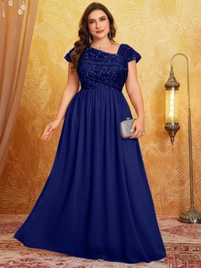Detail of navy blue sequined bodice on long chiffon evening gown with elegant pleated waist