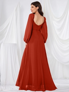Detailed back view of red chiffon bridesmaid dress with open back and bubble sleeves