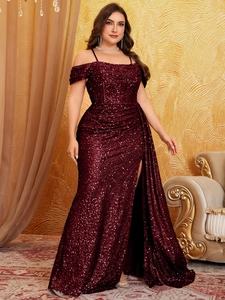 Detail of burgundy sequin evening gown showing the high slit and shimmering fabric texture